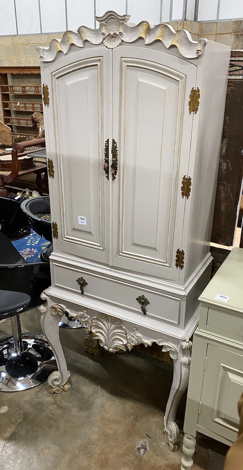 A French grey painted hardwood cocktail cabinet, with parcel gilt decoration, width 75cm height