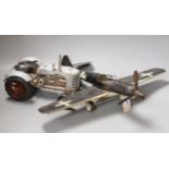 A German tinplate Focke-Wulf model aeroplane, 62cm wingspan, and a tinplate model tractor