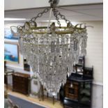 A large five tier graduated glass lustre chandelier,