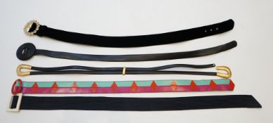 A collection of five Yves Saint Laurent belts