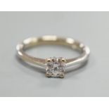 A modern Italian 750 white metal and solitaire diamond ring, size L/M, gross weight 2.8 grams.