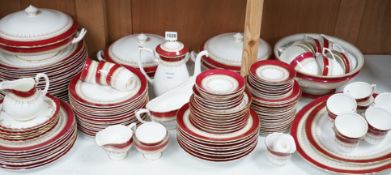 A Royal Worcester Regency pattern red and gilt bordered part dinner service