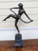 After Faguays, bronze of a female dancer with a swag of flowers,54 cms high