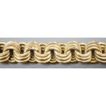 A yellow metal interwoven circular link bracelet, 21cm, 37.6 grams.