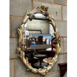 An oval painted frame wall mirror, width 58cm, height 90cm