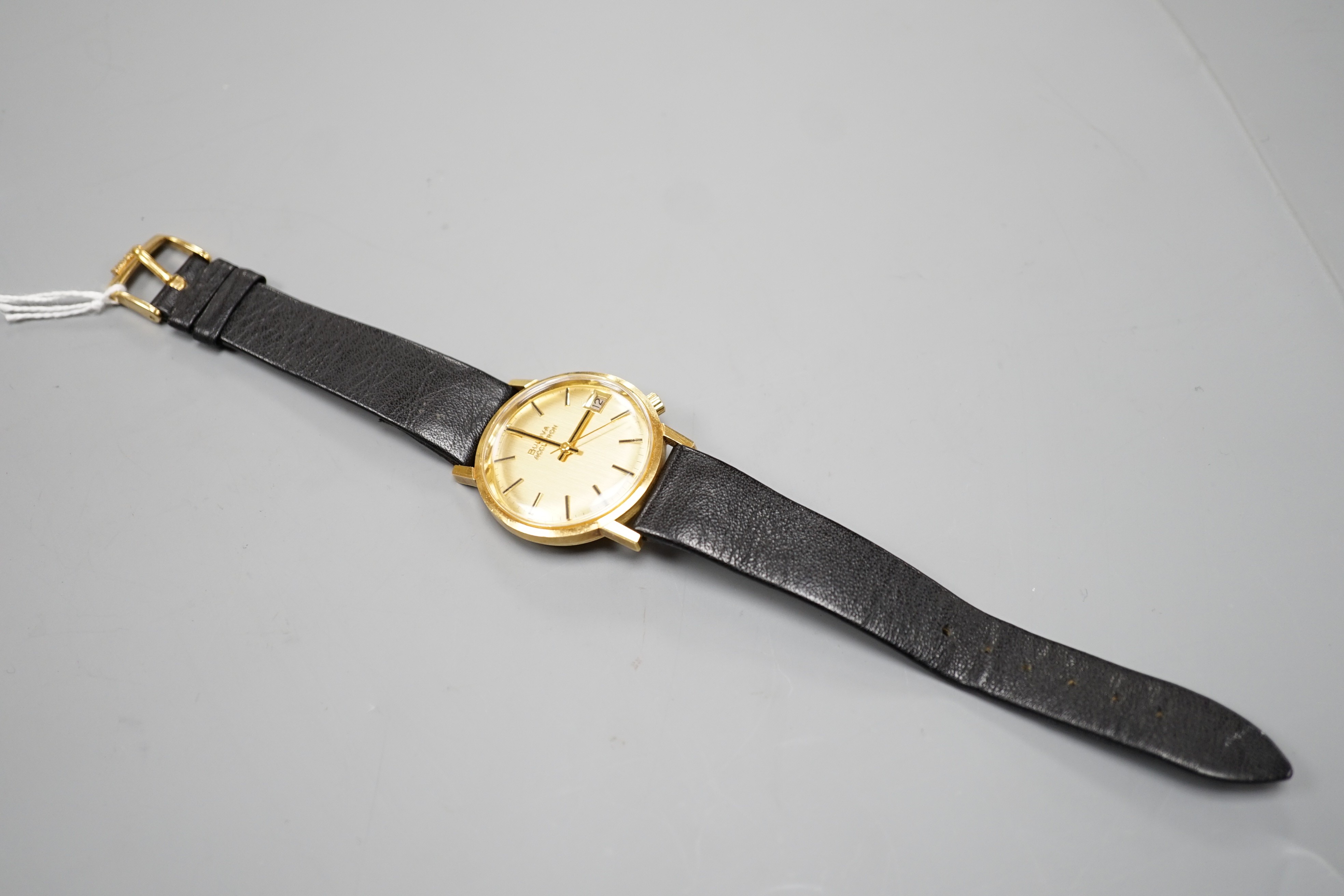 A gentleman's yellow metal Bulova Accutron wrist watch, on a black leather strap, case diameter - Image 2 of 3