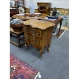 An early 20th century French gilt metal mounted walnut petit commode, width 62cm, depth 44cm, height