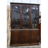 A George III mahogany library bookcase width 184cms, depth 58cms, height 266cms.