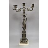 A bronzed spelter figural three light candelabrum, 60cms high
