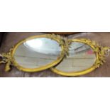 A pair of oval brass framed wall mirrors, width 36cm, height 71cm