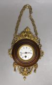 A French faux wood and gilt metal hanging wall clock, 35cm