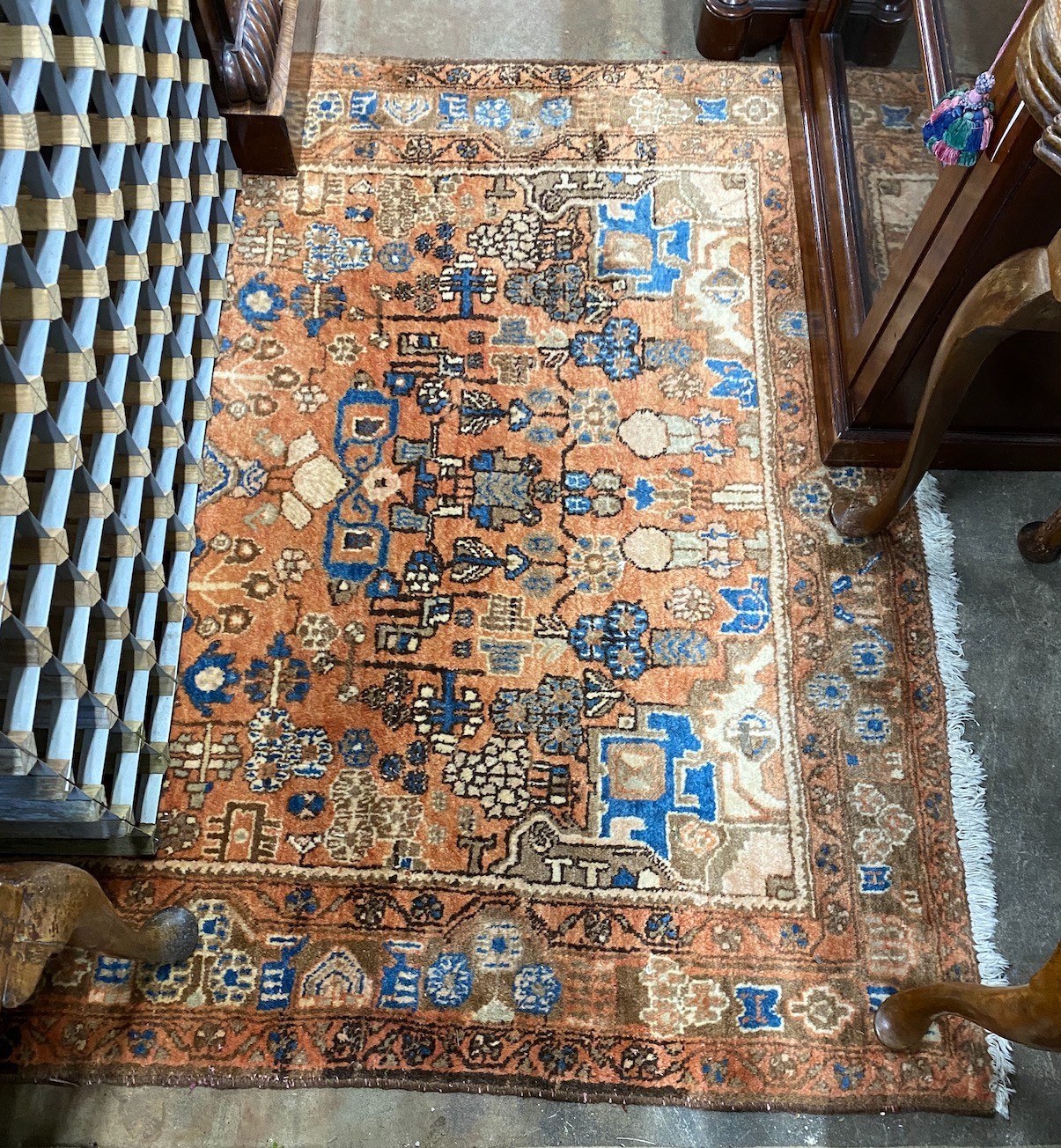 A Caucasian style peach ground rug, 230 x 146cm