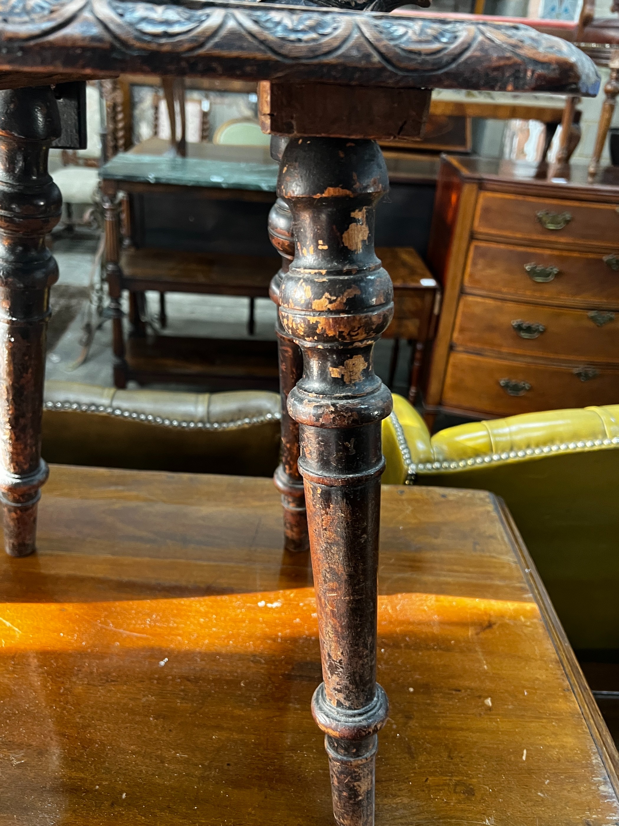 A 19th century Tyrolean oak hall chair, the back carved with a mask, a shell and serpents, height - Image 3 of 3