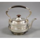 A George V silver tea kettle, lacking stand and burner, Charles Stuart Harris & Sons, London,