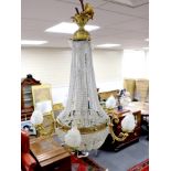 A cut and beaded glass and ormolu bag chandelier, approx 96cms high