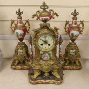 A 19th century Louis XV style gilt metal and porcelain mounted three piece clock garniture, clock