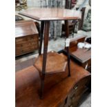 A Liberty & Co. hexagonal oak two tier occasional table, width 38cm, height 66cm