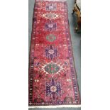 A Caucasian red ground rug, 160 x 100cm and similar runner,