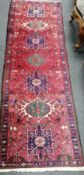 A Caucasian red ground rug, 160 x 100cm and similar runner,