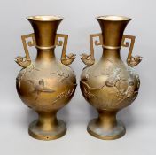 A pair of Japanese two handled bronze vases, 39.5cms high