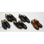 Five pairs of gentleman's Prada shoes; black pointed brogues, size 9Patent trainers, size 9Two-