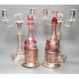 A pair of silver plated two branch, two light candelabra and a pair of silver plated decanter