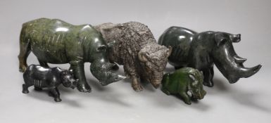 A selection of Zimbabwean animal carvings, to include, two carved Rhinos and two others and a