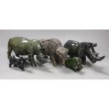 A selection of Zimbabwean animal carvings, to include, two carved Rhinos and two others and a