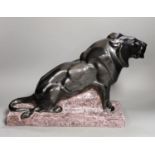 A French Art Deco ceramic model lion, signed Francisque, 31cms high