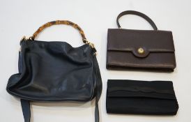 Three vintage Gucci bags; Satin evening purse with damaged claspNavy blue handbag with bamboo