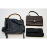 Three vintage Gucci bags; Satin evening purse with damaged claspNavy blue handbag with bamboo