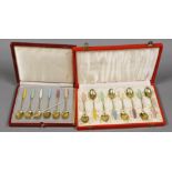 A cased set of eight Danish gilt sterling and polychrome enamelled coffee spoons and a similar cased