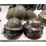 Seven various wartime steel helmets