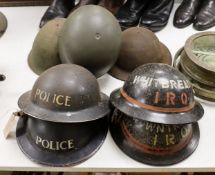 Seven various wartime steel helmets