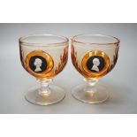 A pair of Wedgwood glass goblets with inset jasper commemorative plaques depicting QEII and Duke