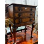 A George III style walnut bedside chest, fitted three long drawers, width 53cm, depth 39cm, height