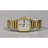 A gentleman's gold plated Omega Seamaster day/date quartz wrist watch, on associated flexible