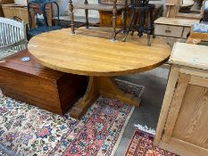 A 'Woodpecker Man' adzed oak dining table, with oval top and chip carved underframe, 170cm x 146cm