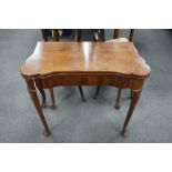 A George III mahogany concertina action folding games table, width 79cm, depth 40cm, height 72cm