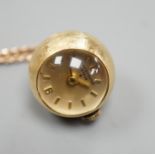 A modern 750 yellow metal Baume & Mercier globe pendant watch, diameter approx. 18mm, on an