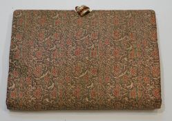 A vintage Christian Dior brocade clutch bag, with faux ruby set clasp and original mirror