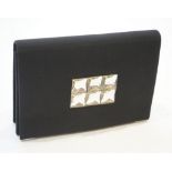 A vintage Yves Saint Laurent black silk satin clutch bag 25 cm.