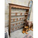 A 19th century Continental fruitwood plate rack, width 130cm height 170cm