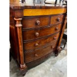 A large mid Victorian mahogany bow front chest of two short and three long drawers, bird's eye maple