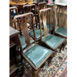 A set of six Georgian walnut dining chairs