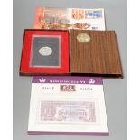 A group of QEII Royal Mint coin years sets, commemorative crowns, £5, £2 and George VI stamp,