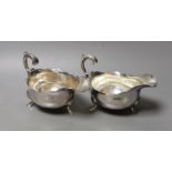 A pair of Georgian silver sauceboats, with flying scroll handles, marks rubbed, length 17cm, 13.