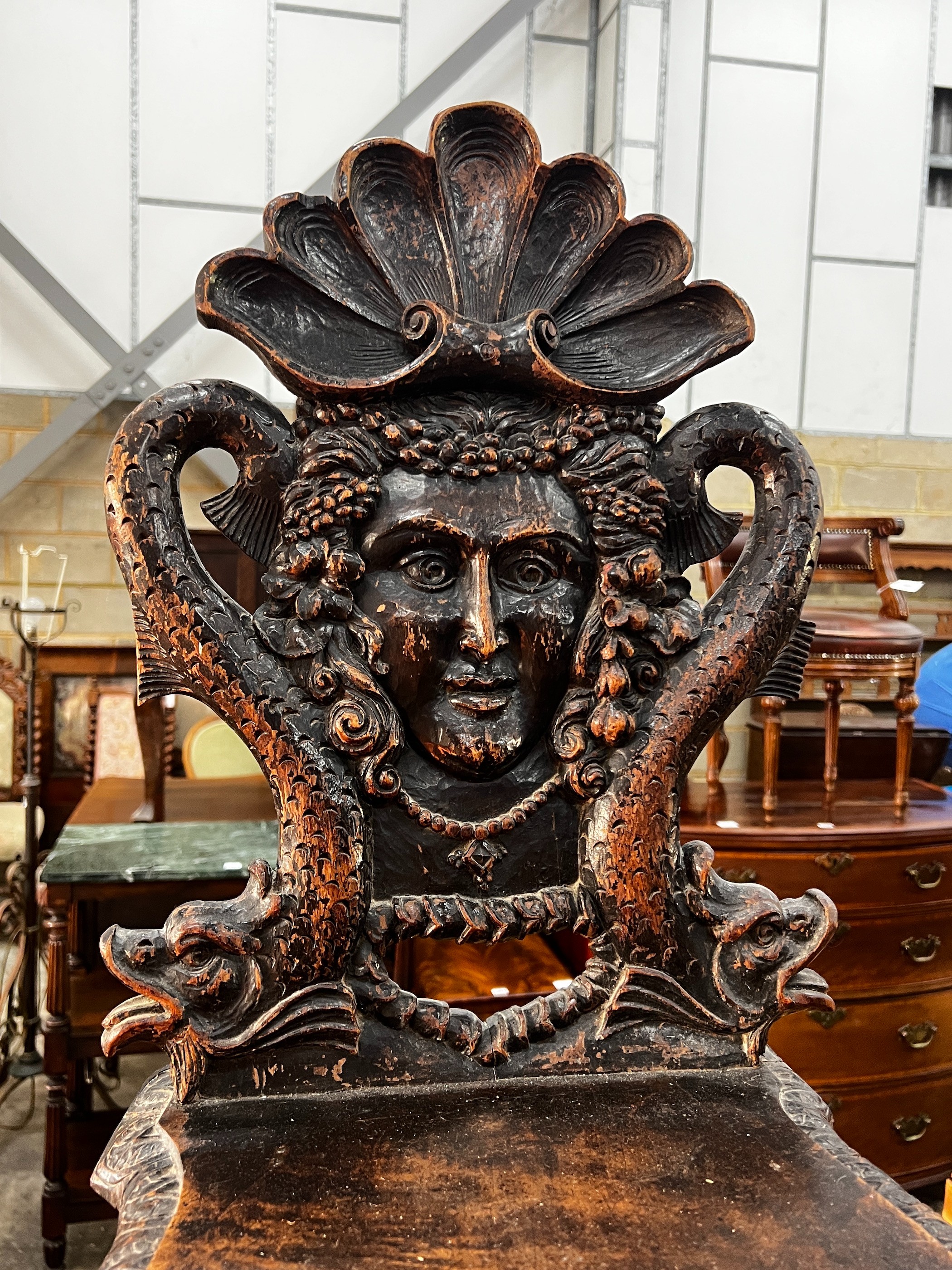 A 19th century Tyrolean oak hall chair, the back carved with a mask, a shell and serpents, height - Image 2 of 3