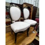 A pair of Victorian mother of pearl inlaid ebonised parcelgilt side chairs, width 52cm, depth