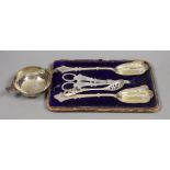 An Elizabeth II silver quaich, Glasgow, 1964, 13cm over handles, a cased plated three piece